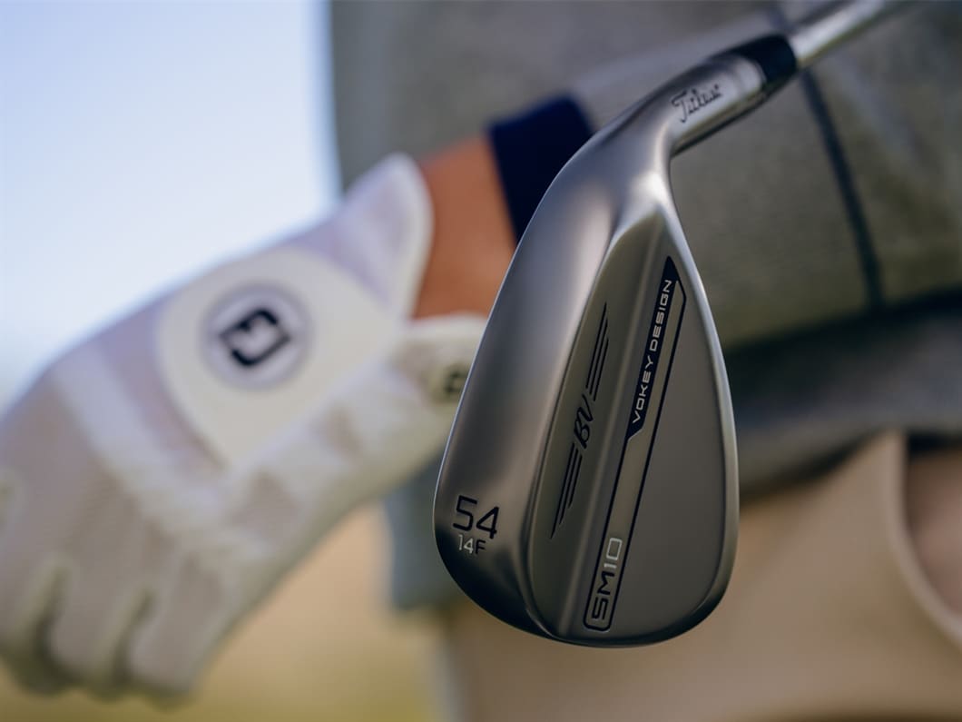 Golfer holding a 54F Vokey wedge