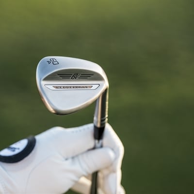 Vokey WedgeWorks A Grind wedge being held up 